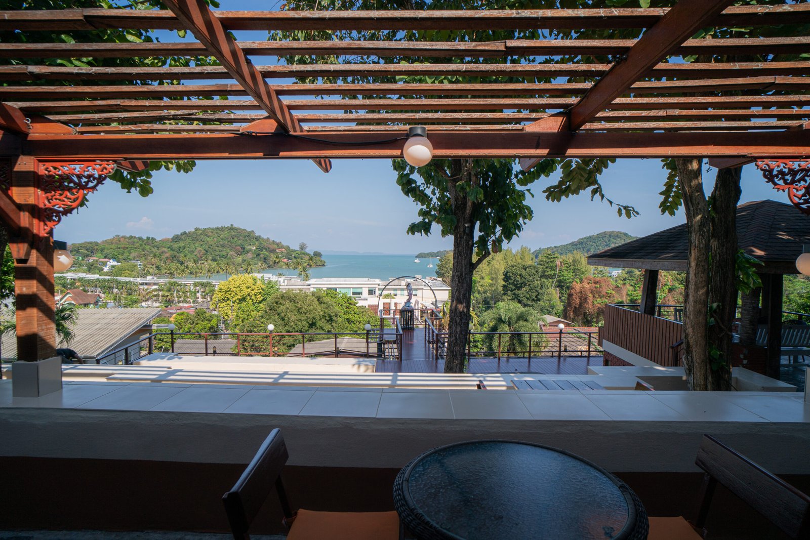 a view of a beach from a deck in phuket island rehab . best rehab in thailand